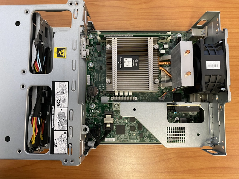 <i>Photo 3 - System board assembly tray pulled out from chassis.</i>